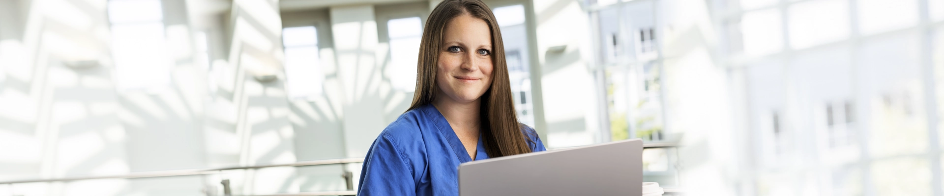 accelerated nursing student with laptop