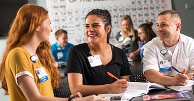 students talking in a science lab